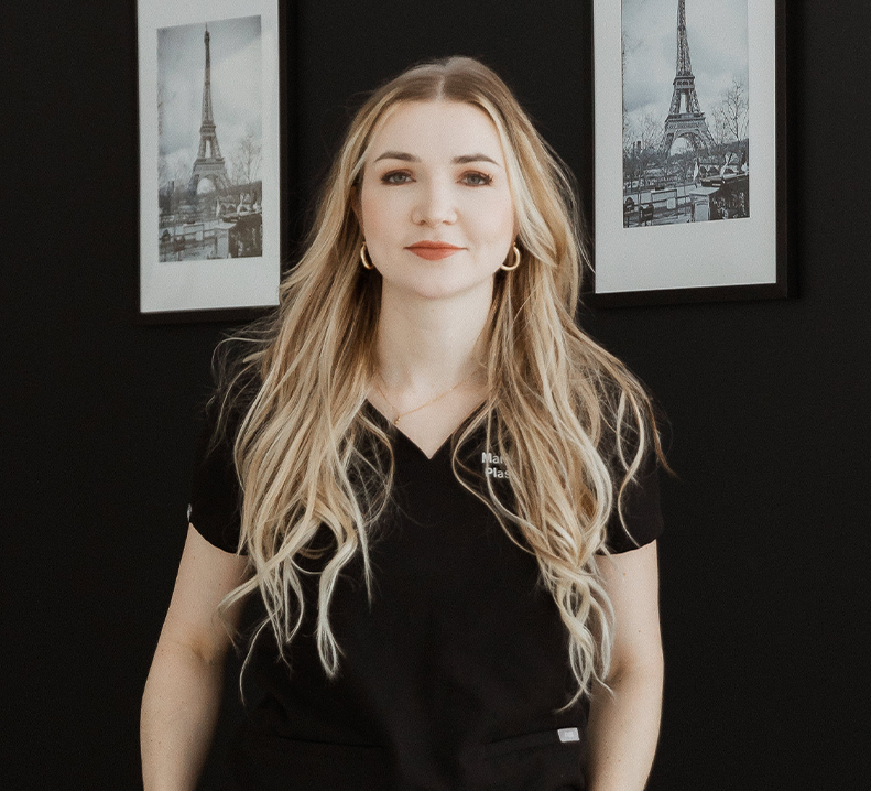 Plastic surgeon Dr. Marie Noland wearing scrubs in Langley & Surrey, BC