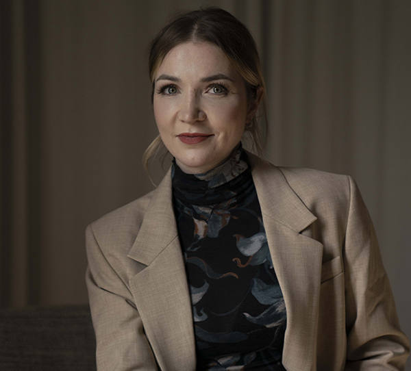 Cosmetic surgeon Dr. Marie Noland wearing a brown suit in Surrey & Langley, BC